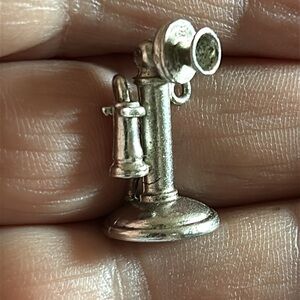 Vintage Wells sterling silver phone and graduation cap charms.Lot of 2